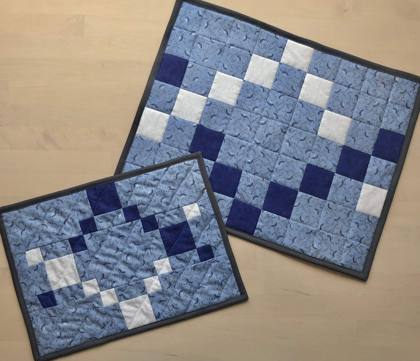 two blue and white placemats.