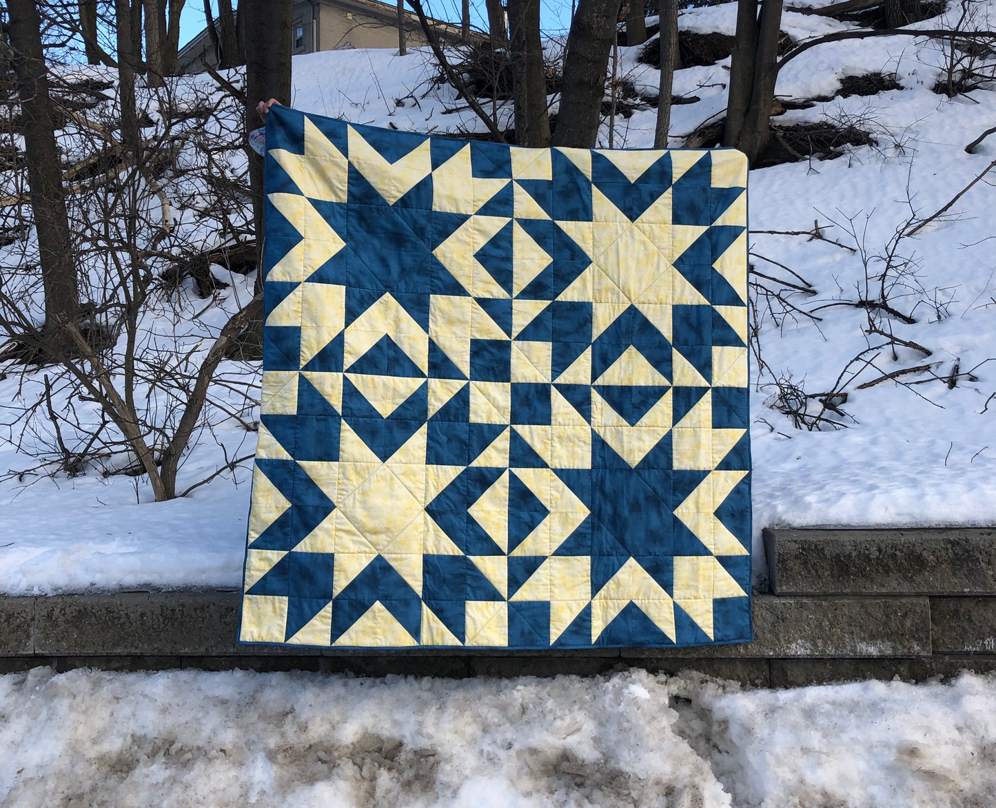 blue and yellow star quilt.