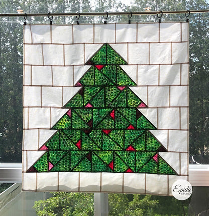 Large stained glass Christmas tree window hanging.
