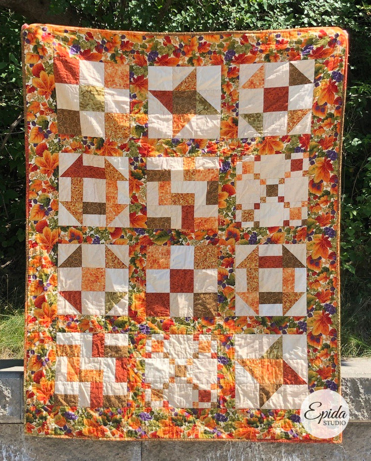 scrappy nine patch quilt in fall colours.