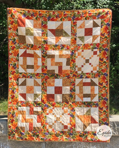 scrappy nine patch quilt in fall colours.