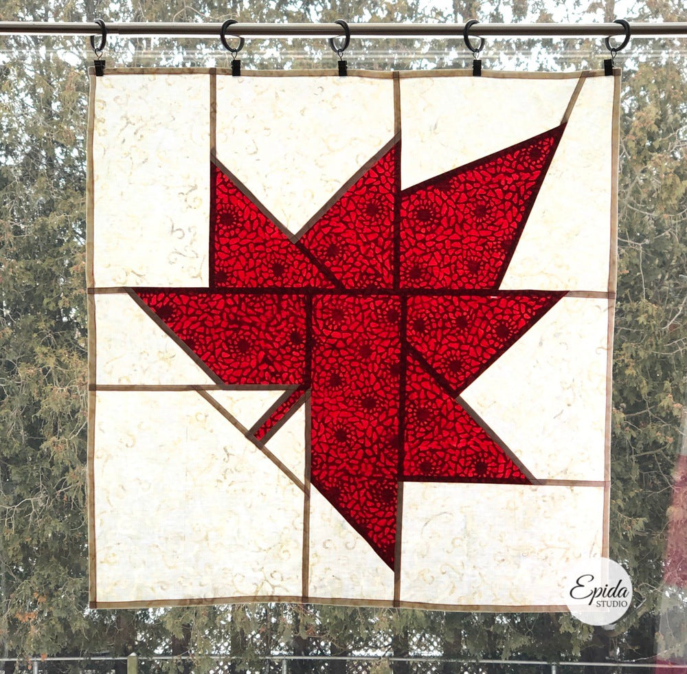 stained glass patchwork window hanging red leaf on white background