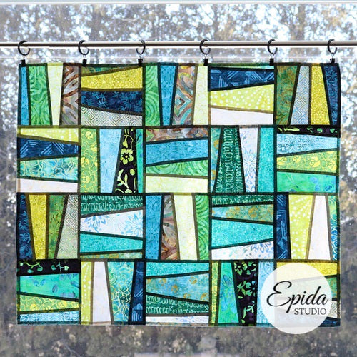 "Weaving" pojagi improv window hanging in green and blue fabric.