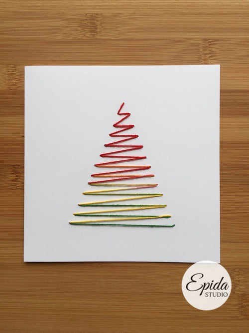 Greeting card with hand-stitched Christmas tree in variegated thread.