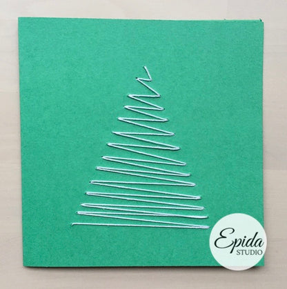 Green greeting card with hand stitched white tree.
