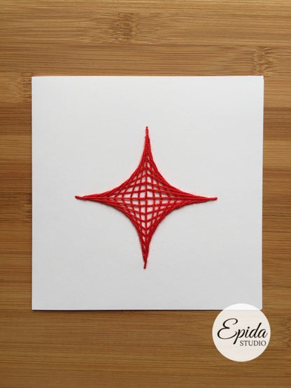 Greeting card with hand-stitched geometric design in red thread.