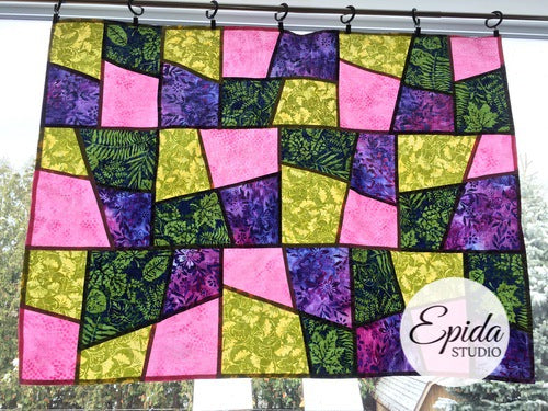 "Checkerboard" pojagi improv window hanging in pink, purple and green.