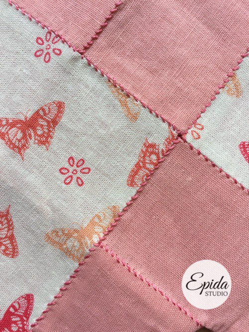 close up of stitching on pink diamonds table runner.