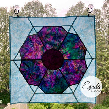 purple and blue stained glass window hanging.