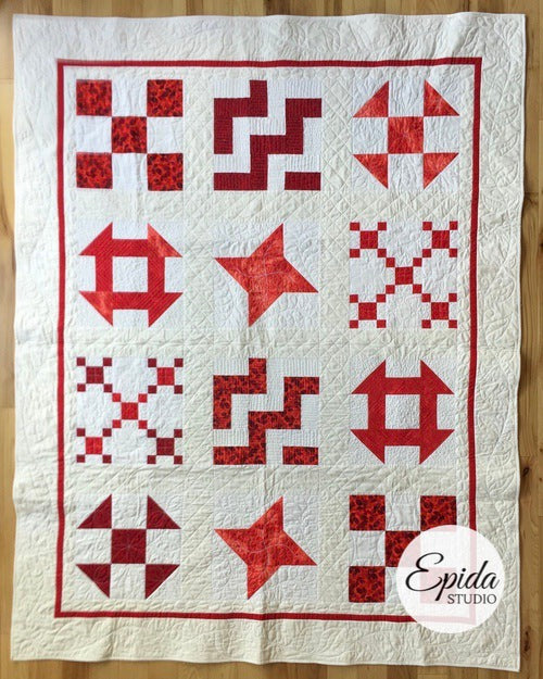 red and white sampler quilt.