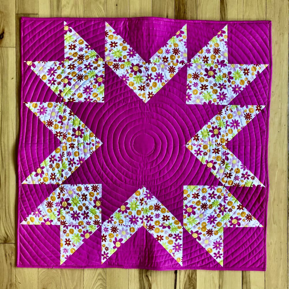 bright pink star quilt.